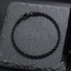 cf71319d-ee84-4afa-9fa2-8fb5931821df PULSERA TRENZADA NEGRA